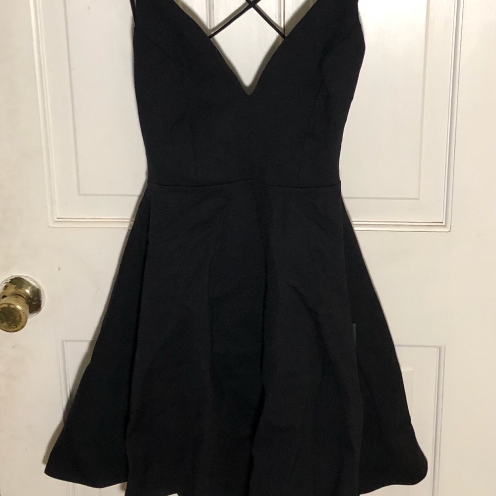 A black, strappy back skater dress from Lulu’s, size medium